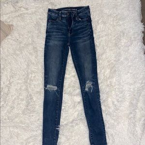 Distressed high rise skinny jeans